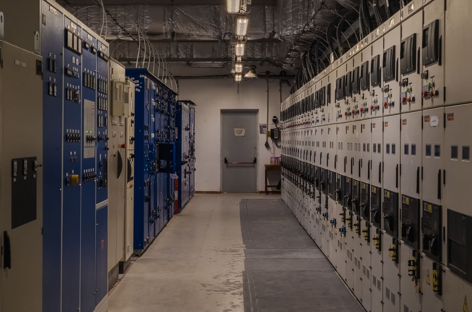 Rows of industrial electrical control cabinets